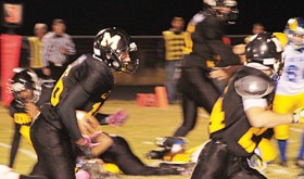 Meeker freshman T.J. Shelton follows teammate Sebastian Clarke against Roaring Fork. Shelton led the Cowboys with 188 yards rushing, helping his team defeat the Rams 34-9 and set a school record with 541 total offensive yards. Meeker will play their final game of the regular season Friday in Hotchkiss.