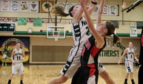 Senior Quincey Thacker (#24) making a shot against Paonia.