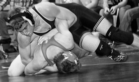 Cowboy freshman Devon Pontine uses a bar arm to turn his Glenwood Springs opponent last Saturday. Pontine pinned all four of his opponents and will enter this weekend’s regional state-qualifying tournament as the No. 3 seeded wrestler in the 152-pound bracket.