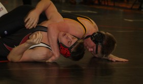 Cowboy senior J.R. Crawford scores back points in a regional tournament match last weekend in Grand Junction. Crawford finished third in the 170-pound bracket and qualified for the state wrestling tournament for a second time. Crawford and seven teammates will compete in the Colorado State Wrestling Championships, which starts today in the Pepsi Center at 3 p.m.