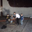 Children’s music recording artist Lois LaFond spent time making music in the tank last week with several Rangely children (from left: Drew Zadra, Zane Wiley and Caleb Wiley). The Friends of the Tank successfully raised more than $46,000 in three weeks to secure and restore the unused water tank for the next generation of sound-makers.