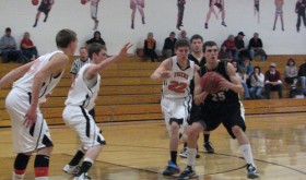Cowboy junior Jeremy Musgrave looks to pass the ball during the district championship game against Hayden, which Meeker lost. Musgrave and the Cowboys (16-6) will play Haxtun (16-5) in the must-win first round of the regional tournament at Mullen High School in Denver, with the winner playing the winner of Denver Christian (16-6) and Highland (7-15). Only the regional champ advances to the “Elite Eight” Colorado State Basketball Championships the following week in Pueblo.