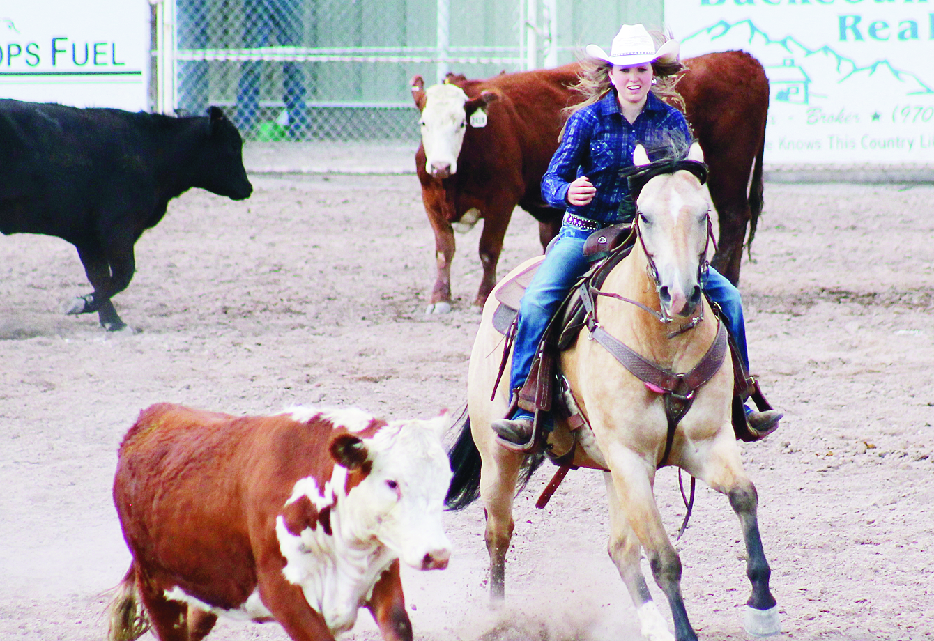 hallie blunt Lori Ann Klinglesmith captured first place in the working cow horse competition, and here she is seen working the cows on Friday night as a pre-Rio Blanco County Fair event held at the county fairgrounds in Meeker. 