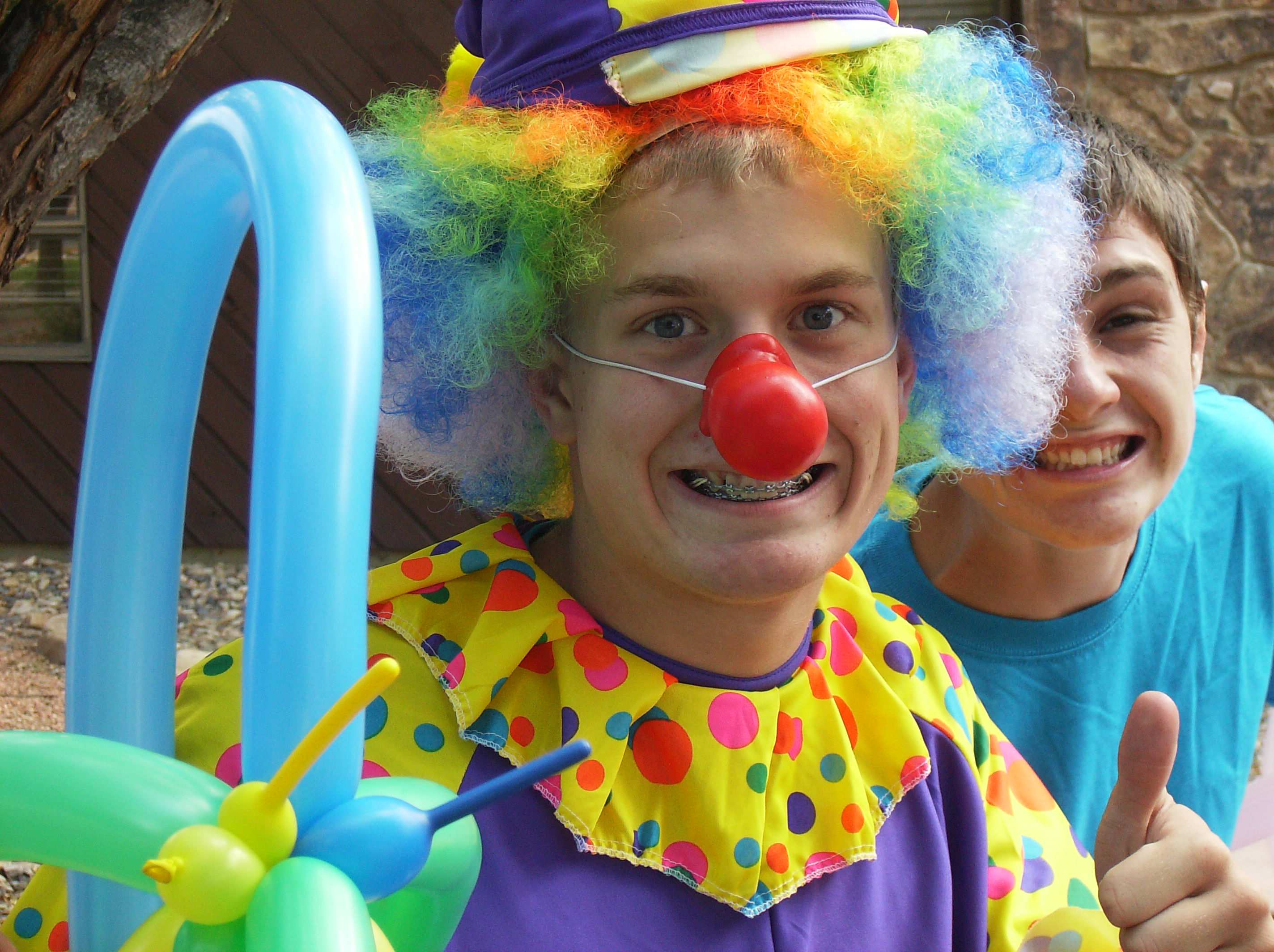 Cole Barlow was a clown for the summer reading carnival at Rangely Library and Logan Osborne, behind Barlow, was a “balloon-tying wizard.”