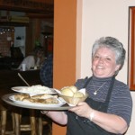 Kathy Sizemore carried an order of chicken and mashed potatoes, which was served for last week’s benefit dinner for the Martin family. The Meeker Cafe sold out of chicken dinners.