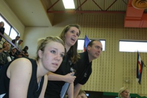 Stacey Fitzgibbons, who had fouled out, watched the action along with assistant coaches Kaleyne Turner and Mike Dinwiddie.