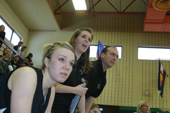 Stacey Fitzgibbons, who had fouled out, watched the action along with assistant coaches Kaleyne Turner and Mike Dinwiddie.