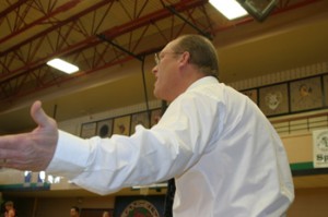 Meeker boys’ basketball coach Klark Kindler argued a call during Saturday’s championship game against Hayden. The Cowboys suffered their first loss of the season.