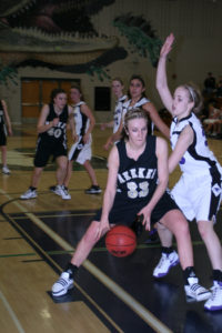 Meeker’s Stacey Fitzgibbons wheels around a Front Range Christian defender for two of her game-high 26 points.