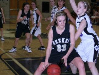 Meeker’s Stacey Fitzgibbons wheels around a Front Range Christian defender for two of her game-high 26 points.