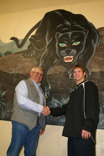Bill Turner, who won Rangely’s first individual state wrestling title, congratulates the newest Panther state champion Travis Witherell. Turner won the 165-pound class in 1958 and Witherell won the 152-pound state title Feb. 20.