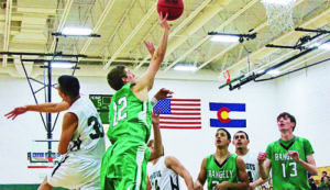 Rangely High School junior Andrew Morton (22) making a side shot. Andrew was high scorer against Plateau Valley. Junior Cameron Enterline (13) and sophomore Luis Contreras (20) assist.