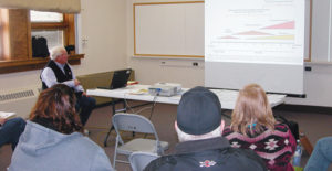 David Mast of Purina Foods, presented a workshop titled “Livestock Nutrition” at the 2013 Agriculture and Business Seminars on Saturday, one of many business and agriculture-related seminars sponsored by the Meeker Chamber of Commerce, the Friends of the FFA Alumni and a number of other groups. Nearly 100 people took advantage of the event. At right, volunteers and Friends of the FFA Alumni cooked and served lunch to the county residents taking part in the day of seminars. Author and speaker Jim Whitt was keynote speaker at the event.