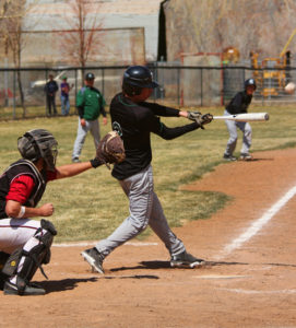 Rangely baseball coach Paul Fortunato said the “great core” of returning starters like seniors Chad Boleng, getting a hit, and Gabe Garcia, top photo, sliding home safely, will “get (the team) back on track” with the help of their younger teammates.