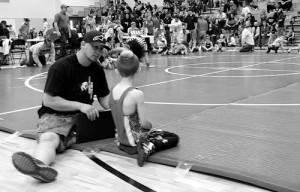 Rangely Youth Wrestling head coach Andy Lucero gets some one-on-one time with his 7-year-old son, Tyce, following Tyce’s successful first match at the Parachute Grapplers Tournament over the weekend. Lucero, who took the program over from Jeff and Sharon Heinle in 2012 with wife Heidi and Rangely locals Lynn and Wade Rusher, said their efforts would be unsuccessful without the support of volunteer coaches and parents.