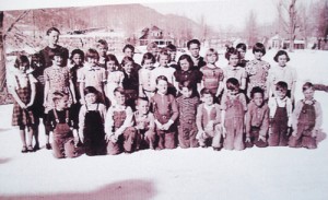 This photograph was taken in front of the foundation of the new elementary school with Mrs. Massie’s third-grade class of 1938-39 in front.