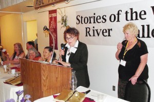 Members of the Rio Blanco County Historical Society’s board, secretary/registrar Haley Kracht, Bill Kracht, treasurer Connie Theos, strategic chair Mary Ann Wilber and co-vice president Sandra Bradfield (at podium) recognize attorney Frank Cooley’s 90th birthday; co-president Kay Bivens (far right).