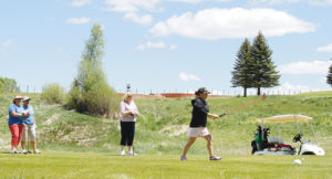 Amanda Back (walking up to ball) and Sherry Rubin (center) were matched with sisters Patty Edwards and Ellen Boudreaux in the annual Ladies DearFly tournament at the Meeker Golf Course on Saturday. Back and Rubin shot a tournament-best five-under-par 29 on the front nine and tied for the best gross score (66). The duo also took top net honors in the competitive first flight.
