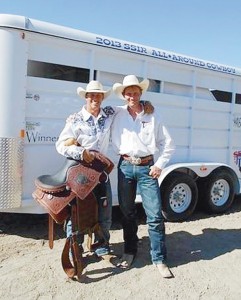 Incoming CNCC freshman Wade “Whiplash” Grimshaw poses with his SSIR All-Around-Cowboy saddle, buckle and horse trailer standing next to CNCC rodeo coach Jed Moore.