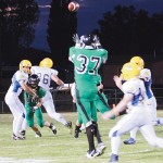 Junior Colt Allred catches a pass from Kelton Elam against Dove Creek. 