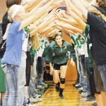 Rangely senior Aimee Hogan runs out of the tunnel and onto the court where she “assisted” her team in a big homecoming win over West Grand.