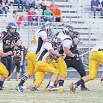 Cowboy senior J.C. Henderson following his blockers.