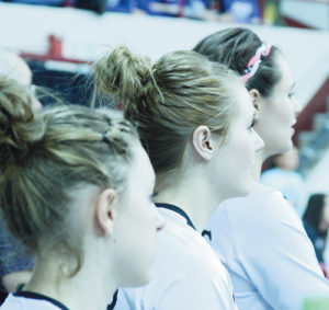 Juniors Jamie McLaughlin, Pearce and Jones take in the experience before taking court inside the Denver Coliseum.