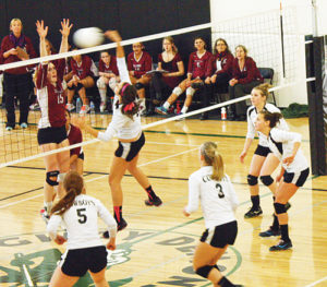 Meeker junior Paige Jones spikes the ball over the net against Telluride, with teammates Hughes, Neilson, Haney, Pearce and Ridings backing her up.