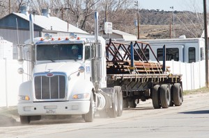 A BTI truck moves equipment from its Rangely lease space on River Road, the former office of KR Fishing and Rental. The oil and gas fishing and rental company closed its doors Monday, laying off eight employees and moving all equipment out this week.