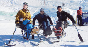 Colorado Northwestern Community College rodeo coach Jed Moore added a new component to the annual winter festival tradition in Steamboat Springs. He invited several cowboys and cowgirls with spinal cord injuries to join the competition. From left to right, Amberley Snyder, Billie Sutton and Jed Moore pose on the mono Sit Skis provided by Steamboat STARS Adaptive Skiing Program.