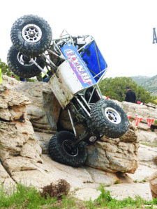 | josh england | rise above photography | Unlimited competitor 14-year-old Olivia Messer from Fresno, Calif., rolls down the A3 obstacle during competition. Nobody was injured in the hard-hitting rollover.