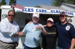 Chevron donated $5,000 to the Rangely Elks Club Christmas baskets fund during Septemberfest at the Elks’ drug awareness trailer. From left to right are: Ross Alire, a specialist with Chevron; Tink Wilson, a past exalted ruler with the Elks and Elks officers Cody Reed and Mike Dillon.