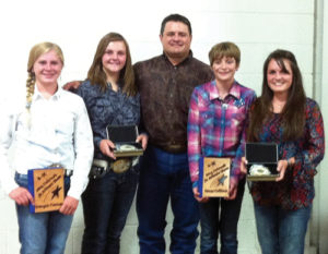 This photo was taken at the 2014 Colorado State Fair ceremony in Pueblo for the 4-H members who made the Junior and Senior All-State livestock judging teams. Rio Blanco County 4-H had four livestock judges make the all-state teams this season. From left to right are: Kenzie Turner of Meeker, a first-year member of the Junior All-State  Team; Samantha Lapp of Rangely, a two-year qualifier for the Junior All-State Team;  Coach Clint Shults of Meeker; Macy Collins of Meeker, a first-year member of the Junior All-State Team; and Madi Shults of Meeker, a fifth-year  member of the Colorado All State 4-H Livestock Judging Team. Of the 10 junior members making the all-state team, eight were from the Western Slope.