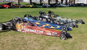 Four brightly colored dragsters took part in the Septemberfest parade and then the annual car show in Elks Park. The speedy machines had more than a few admirers and likely more than 1,000 people attended the car show, the arts and crafts fair, and the town barbecue.