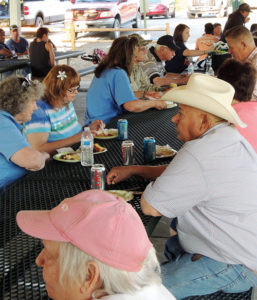 New Creation Church fed a couple hundred folks with its annual pork barbecue in Elks Park on Sunday evening.
