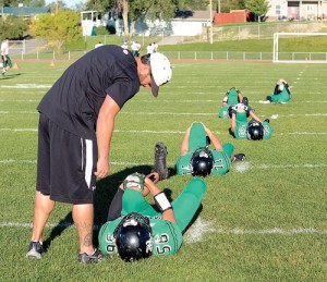 Rangely High School football coach Paul Fortunato encourages his players before last Friday's home game against Plateau Valley. The Panthers won to remain undefeated.
