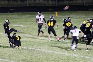 Freshman quarterback Logan Hughes held the snap for senior Raul Lopez who kicked an extra point after the two connected on a 44-yard pass for a touchdown. Lopez caught two passes, both went for touchdowns. The first, on the first play of the game, was thrown by starting quarterback Jake Phelan, who helped his team earn a 38-0 lead in the second quarter before handing off the snaps to his younger cousin Hughes.