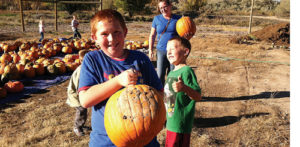 Cory Shonts gives big brother Nate a thumbs-up for his choice of pumpkin at the Rangely Community Gardens while the boys’ mom, Janette Shonts, looks on. The Gardens gave away more than 550 pumpkins to area residents this year.