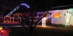 Rangely firefighter Mike Cushman kept his Christmas decorations, which depict a firefighter putting out a house fire, on familiar territory following his occupation. The lights, which depict two firemen and a pumper truck, are located at 215 W. Rio Blanco.