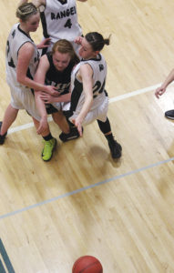 The Rangely High School girls’ basketball team, including Desiree Coombs, Lindzey Thacker and Katelyn Brown, tried to box in Meeker’s Sydney Hughes and her teammates Tuesday. They were able to contain the MHS girls in the first half, but Hughes and her Meeker teammates came back in the second half, took control and went on to a 40-25 win. The Meeker boys went 12-0 on the season with a 42-36 win over the Panthers Tuesday at Rangely.