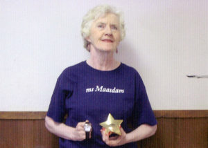 Elaine Jordan shows off the gold paperweight for winning her ship’s competition with professional dancer Christian and the watch she won for competing in the cruise ship line’s national competition.