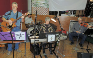 The Clover Loafers played host to more than 100 guests on Saturday night for a free Valentine’s Day dance at the Hugus Building in downtown Meeker. Members of the band are, in front, from left to right, David Mains on guitar, Mary K. Krueger on keyboard and Dave Cole on violin with drummer Brett Smithers in back on the drums. The event drew a wide range of dancers from those in their teens to those whose teen years are in the distant past, but all seemed to have fun.