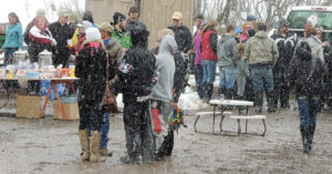 The snow started coming down just as those at the “I Ride with James” snowmobile and poker run up County Road 8 from the Lost Creek Trailhead were getting ready to eat after the three-hour trail ride. Plenty of burgers, hot dogs, bratwursts, cookies, cakes and assorted goodies were on hand to feed well in excess of 100 people.