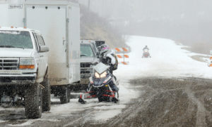 While the hills near the launch site for the “I Ride With James” snowmobile and poker run on Sunday were quite bare, County Road 8, beginning at the Lost Creek Trailhead, had sufficient snow for the snowmobilers to head up to higher altitude where there was quite a bit of snow, making for a successful three-hour ride. Money raised at the ride helps fund two $1,000 scholarships for Meeker High School seniors—one boy and one girl. Other funds go to assist Rio Blanco County Search and Rescue. 
