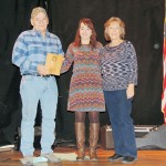 at the Rangely Chamber of Commerce’s Crab Crack on Saturday, the award for Business of the Year was presented to Heritage Building and Home Center. Pictured from left are: owner John Hume, Chamber Executive Director Kristin Steele, and co-owner Becky Hume.