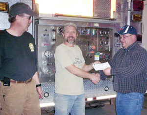 Wade Bradfield, chairman of the board, and Steve Allen, fire chief of the Rio Blanco Fire Protection District, would like to thank Chevron for its $4,000 donation to go toward gas monitors. The check was presented by Chris Archuleta.