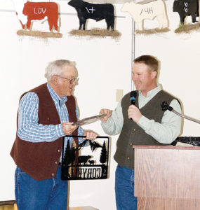  Ed Coryell, left, was honored at the Rio Blanco County Stockgrowers’ Association dinner on Saturday for his 35 years of service as Colorado Brand Inspector. A good crowd was on hand for the group’s annual meeting on Saturday afternoon and the dinner and dance Saturday night. The award was presented by Stockgrowers’ Association President Kelly Sheridan, right.