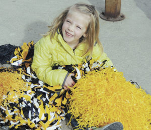 While quite a few folks gathered along Main Street in Meeker on Wednesday morning to send off the Meeker High School boys’ basketball team to the state tournament in Pueblo over the weekend, Reagan Clatterbaugh demonstrated her own excitement by covering herself in MHS pompons at the intersection of Sixth and Main streets and cheering on the team as they left town.