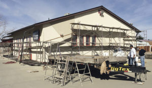 Rangely’s Bank of the San Juans building on Main Street got a facelift this week when Grand Junction’s Calvin Stucco and Stone, Inc., applied a latex cement called Genesis to the building’s cracked and shrinking stucco exterior. A fiberglass mesh was embedded over the existing stucco, followed by troweling on the cement over the existing stucco. Calvin Stucco owner Mark Calvin said the process creates a hard finish designed to last for 10 to 15 years.