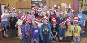 Read Across America was celebrated the week of March 2-6 at Meeker Elementary School.During library, the students learned about Theodore Seuss Giesl and his love of illustrating and writing books for children. Seuss’ birthday party was held on March 2. To start the day, 26 high school Life Skills students read a Seuss book to each class. Shana Holliday’s marimba band performed as everyone came in and settled down and  Kathleen Kelley’s high school English literature class performed four Dr. Seuss books in reader’s theater. Pictured above is Renay Mobley’s fourth-grade class in the library.